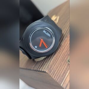 An Original Black Silicone Slap Watch featuring a minimalist analog dial